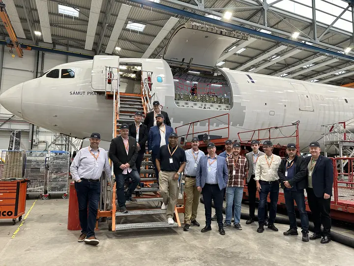 Participants of the ISTAT Freighter Forum conference 2024 in front of an EFW aircraft